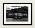 end game, black and white photograph of a lakeside villa and wooden motorboat, A2 print in a black wood gallery frame with an even museum mat